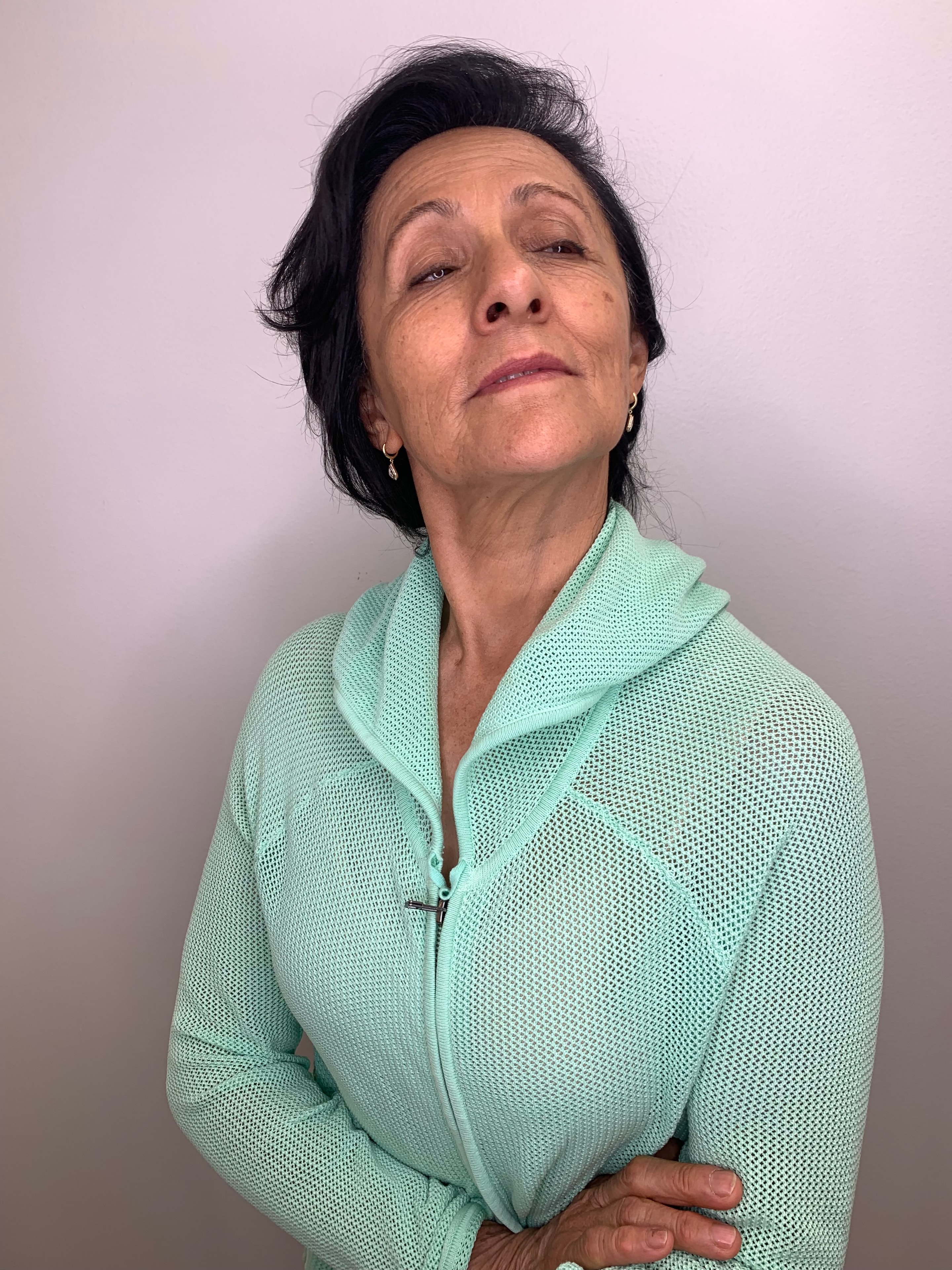 A confident woman with a beautifully styled cut, photographed in the salon
